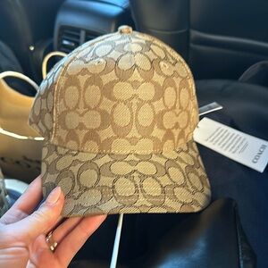 Coach tan logo baseball cap. New with tags. Never worn. Authentic.